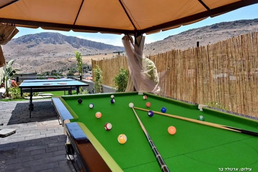 Dream House – snooker table in the garden facing Mount Arbel