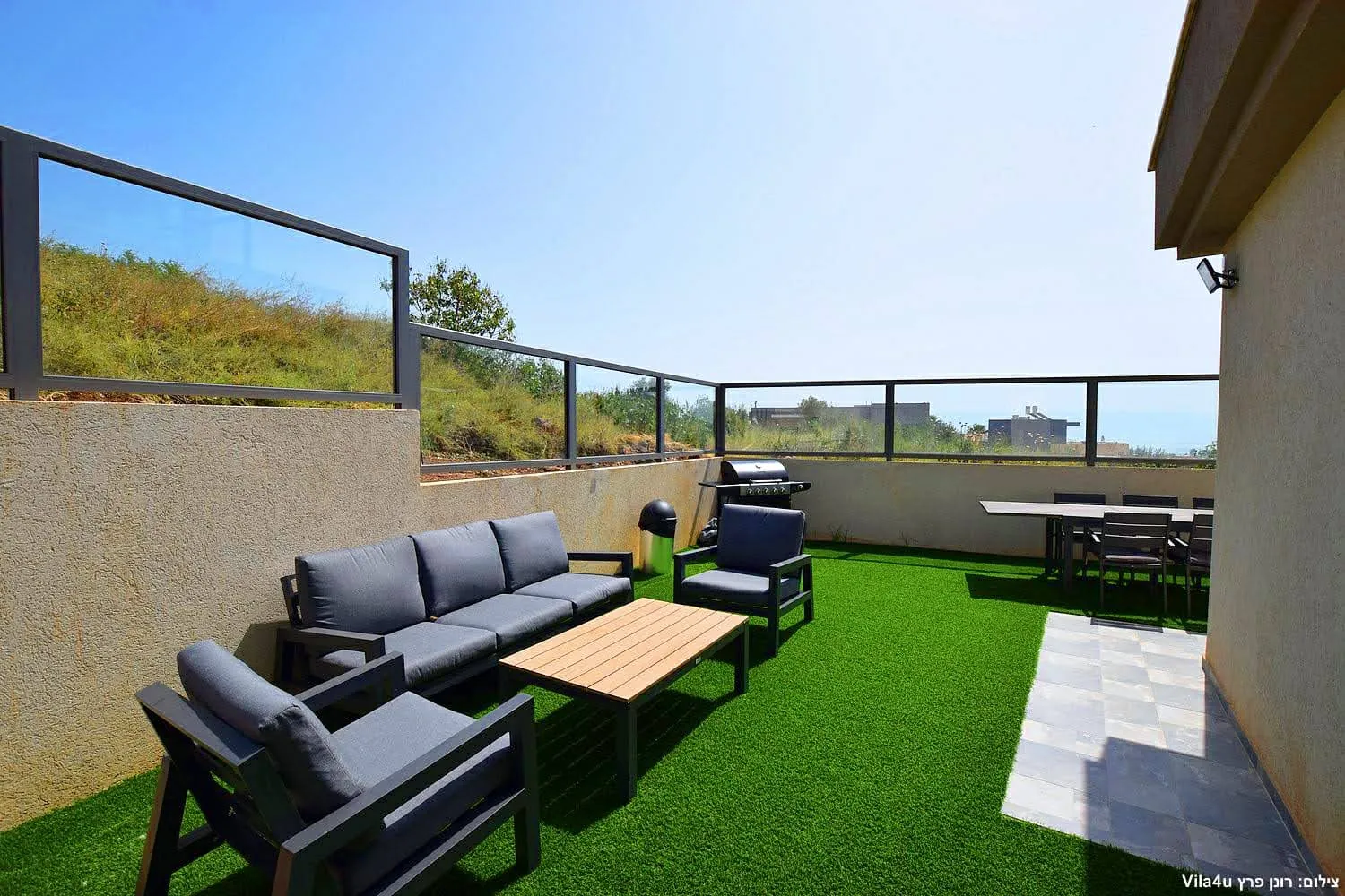 Kinneret House – garden sofas, dining table and barbecue